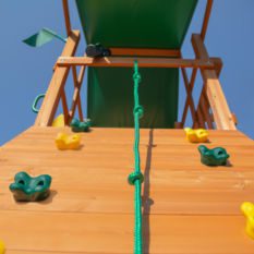 An OUTING SWING SET with green and yellow climbing ropes.