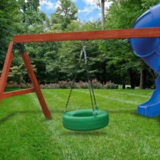 A wooden swing set with a tire slide and Tire Swing Beam.