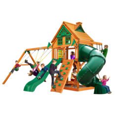 A wooden play set with a slide and swings.