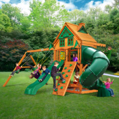 A wooden play set with a slide and swings.