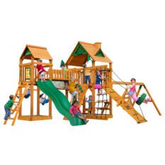 Kids playing on yellow swing set with green slides