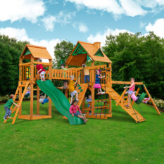 A Chateau w/ Clatter Bridge & Tower, Tire Swing, Swing Set with a slide.