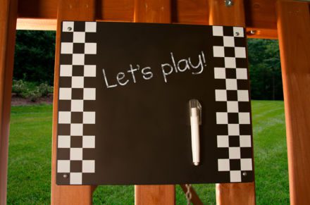 A black and white checkered Chalkboard Kit with a pen on it.
