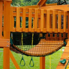 A TREASURE TROVE II SWING SET wooden play structure.