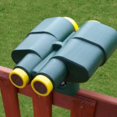 A pair of Jumbo Play Binoculars on a wooden fence.
