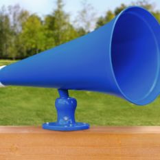 A blue Megaphone on top of a wooden fence.