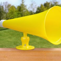 A yellow Megaphone sitting on a wooden fence.
