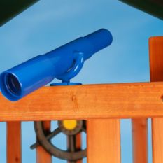 A blue play telescope sits on top of a wooden play structure.