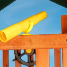 A yellow Play Telescope is attached to a wooden structure.