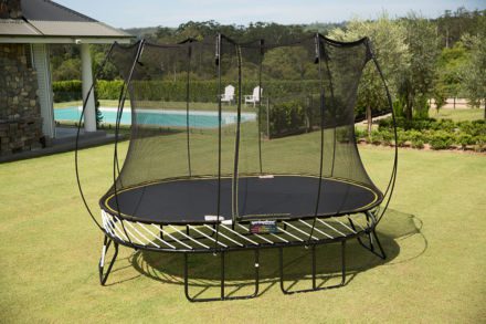 A SpringFree Medium Oval Smart Trampoline on a grassy area.