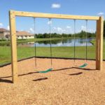 Swing set with wooden frame