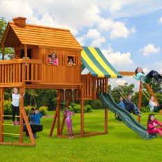 Tree house cabin with a slide and swing set