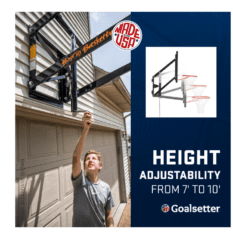 A man is holding a GS54 WALL-MOUNTED basketball hoop in front of a garage.