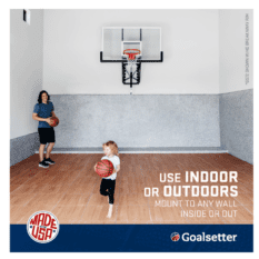 A GS54 WALL-MOUNTED basketball court with a man and a woman playing basketball.