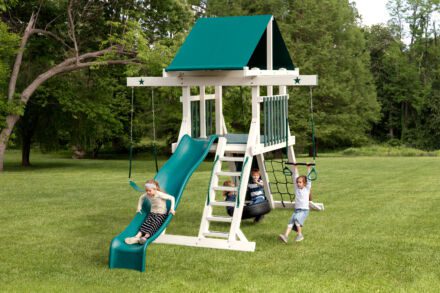 White swing set with turquoise slide, trap bar, and tire swing