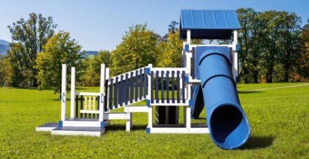 White and blue playhouse with steps and tube slide